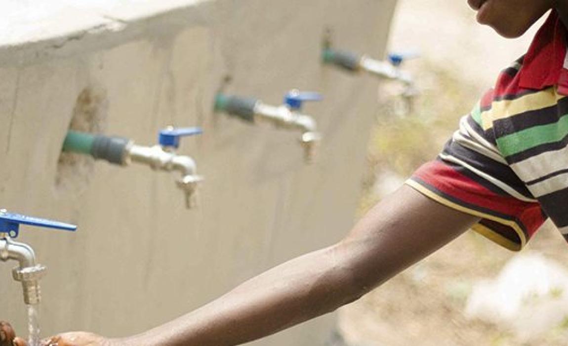 Boy by water tab